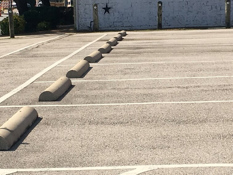 Parking lot striping and wheel stop installation in Prosper, Texas